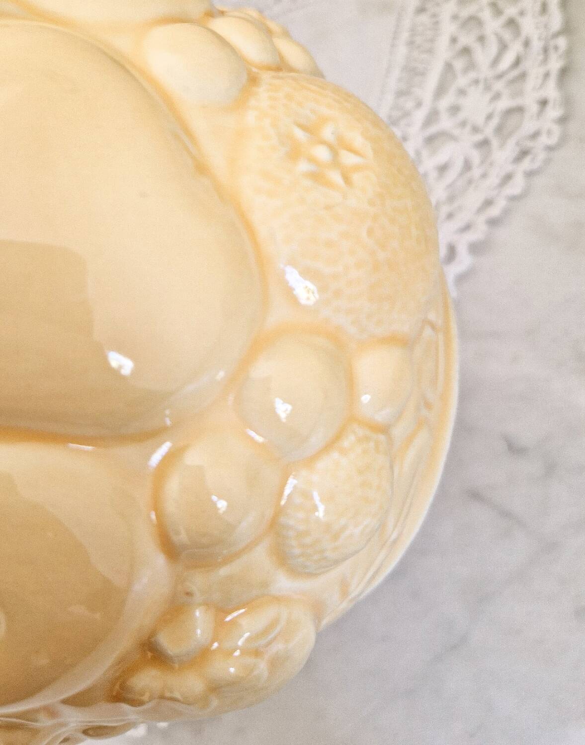 Vintage yellow pitcher in fruit slip