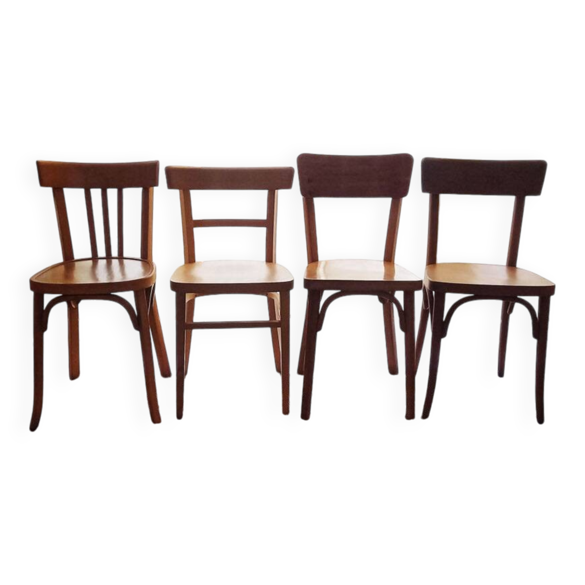 Set of 4 light wood bistro chairs stamped Baumann and Thonet.