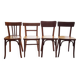 Set of 4 light wood bistro chairs stamped Baumann and Thonet.