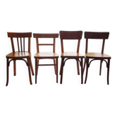 Set of 4 light wood bistro chairs stamped Baumann and Thonet.
