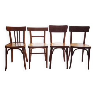 Set of 4 light wood bistro chairs stamped Baumann and Thonet.