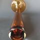 Two vintage Scandinavian double-layered amber blown glass candlesticks