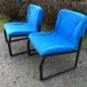 Electric blue fabric designer armchairs with black lacquered metal legs from the 80s.