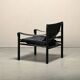 Fauteuil de salon Sirocco Safari Arne Norell en cuir noir et frêne teinté.
