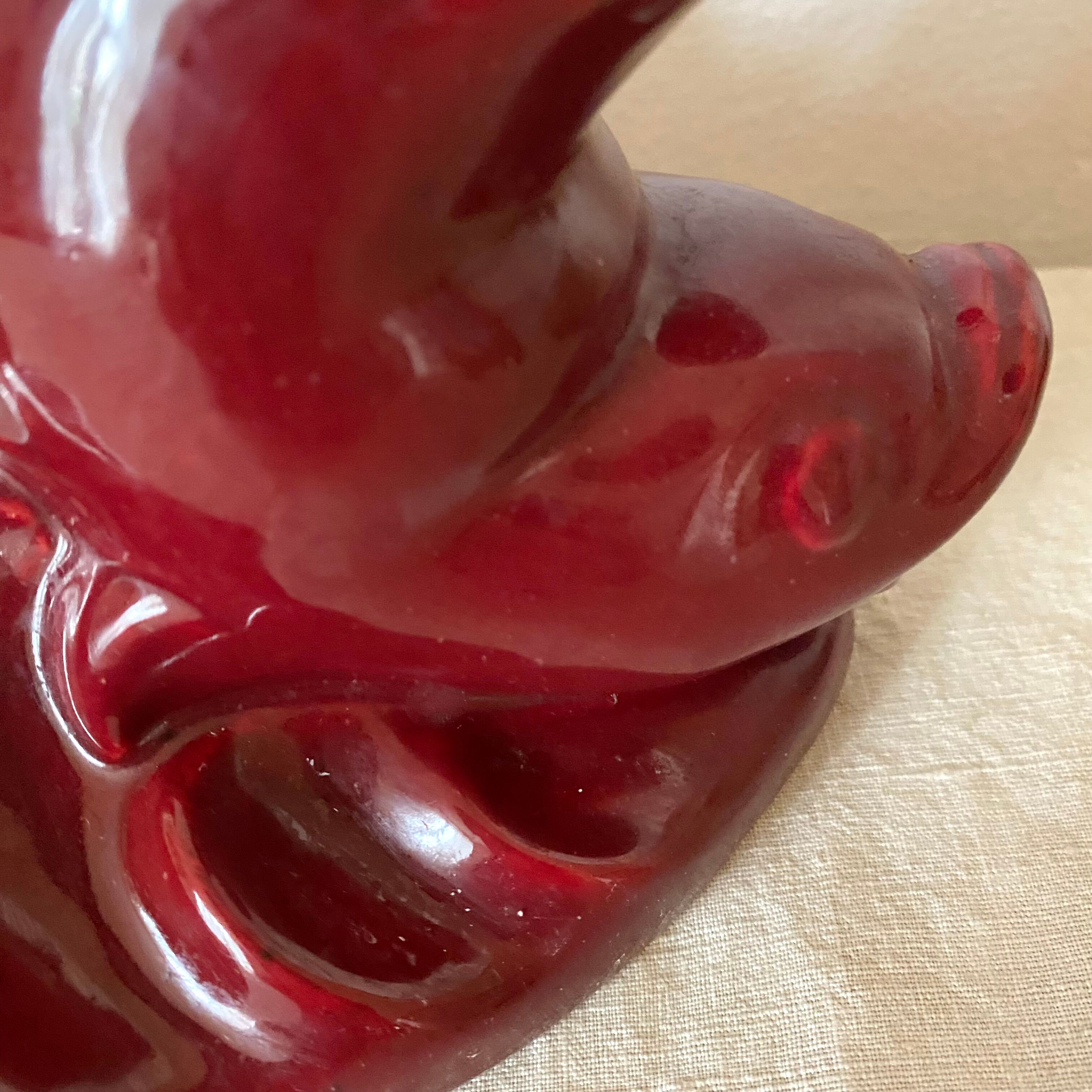 Red ceramic zoomorphic candle holder
