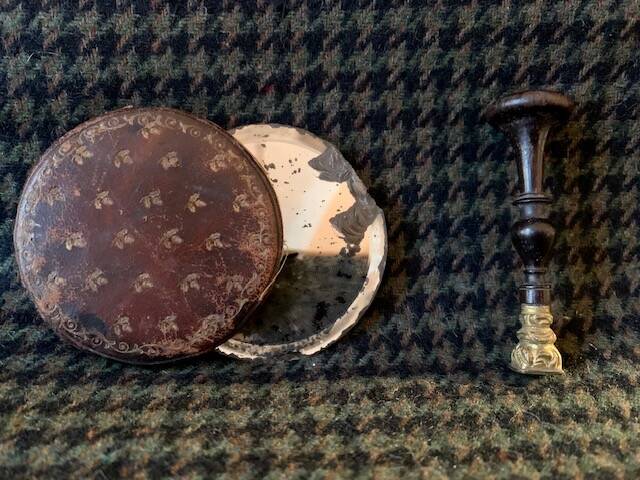 Very old round pocket mirror and leather case, 18th century