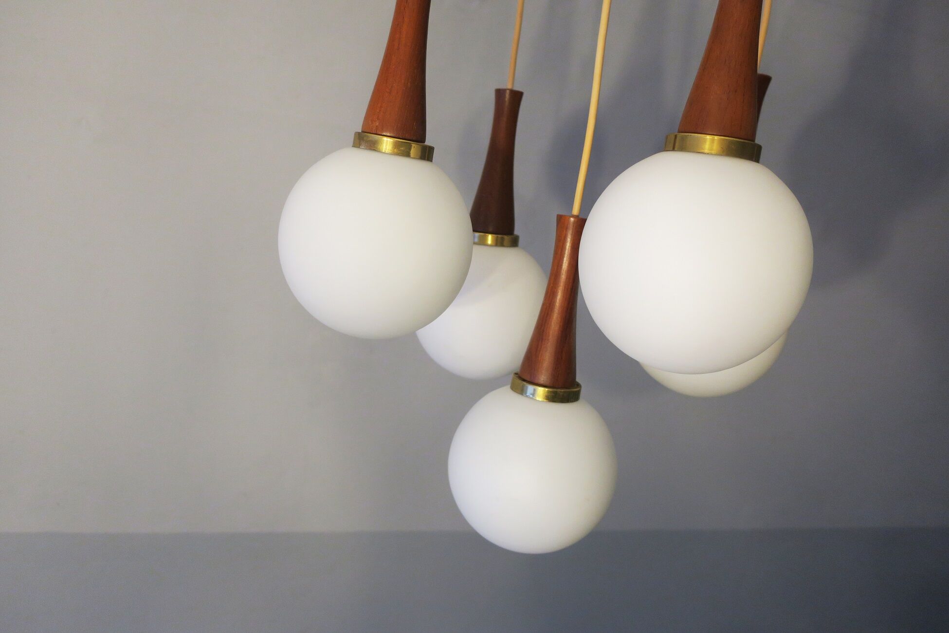 Danish brass and teak cascading 5-globe chandelier, 1960