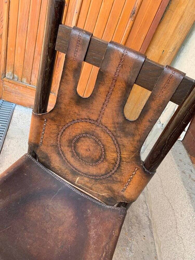 Handcrafted brown leather armchair, dark wood frame, circular pattern - 1970s.