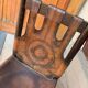 Handcrafted brown leather armchair, dark wood frame, circular pattern - 1970s.