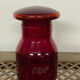 Red glass bottle