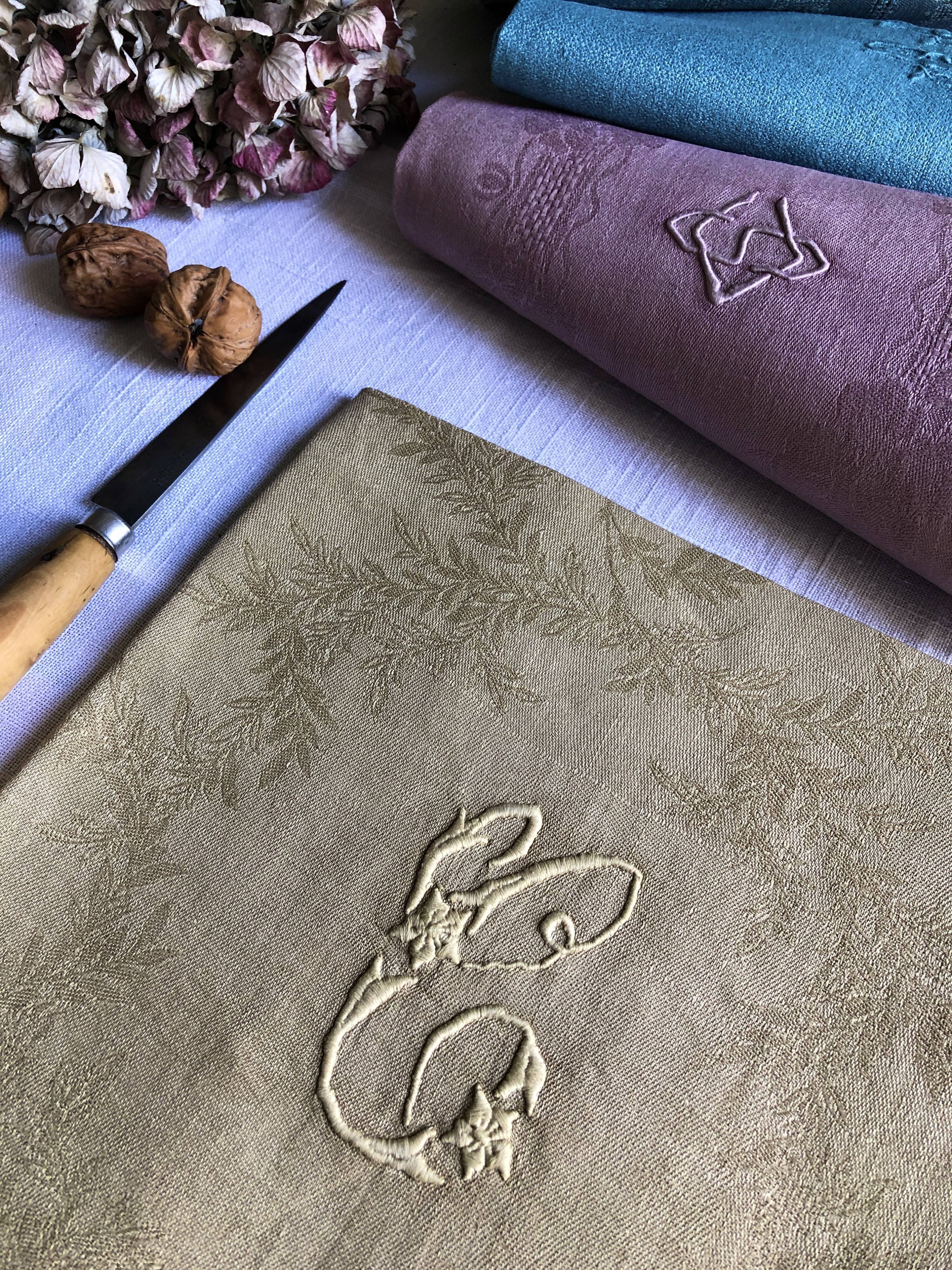 Suite of four tinted antique napkins