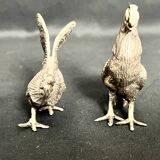 Showcase objects, two 20th century metal rooster and hen subjects