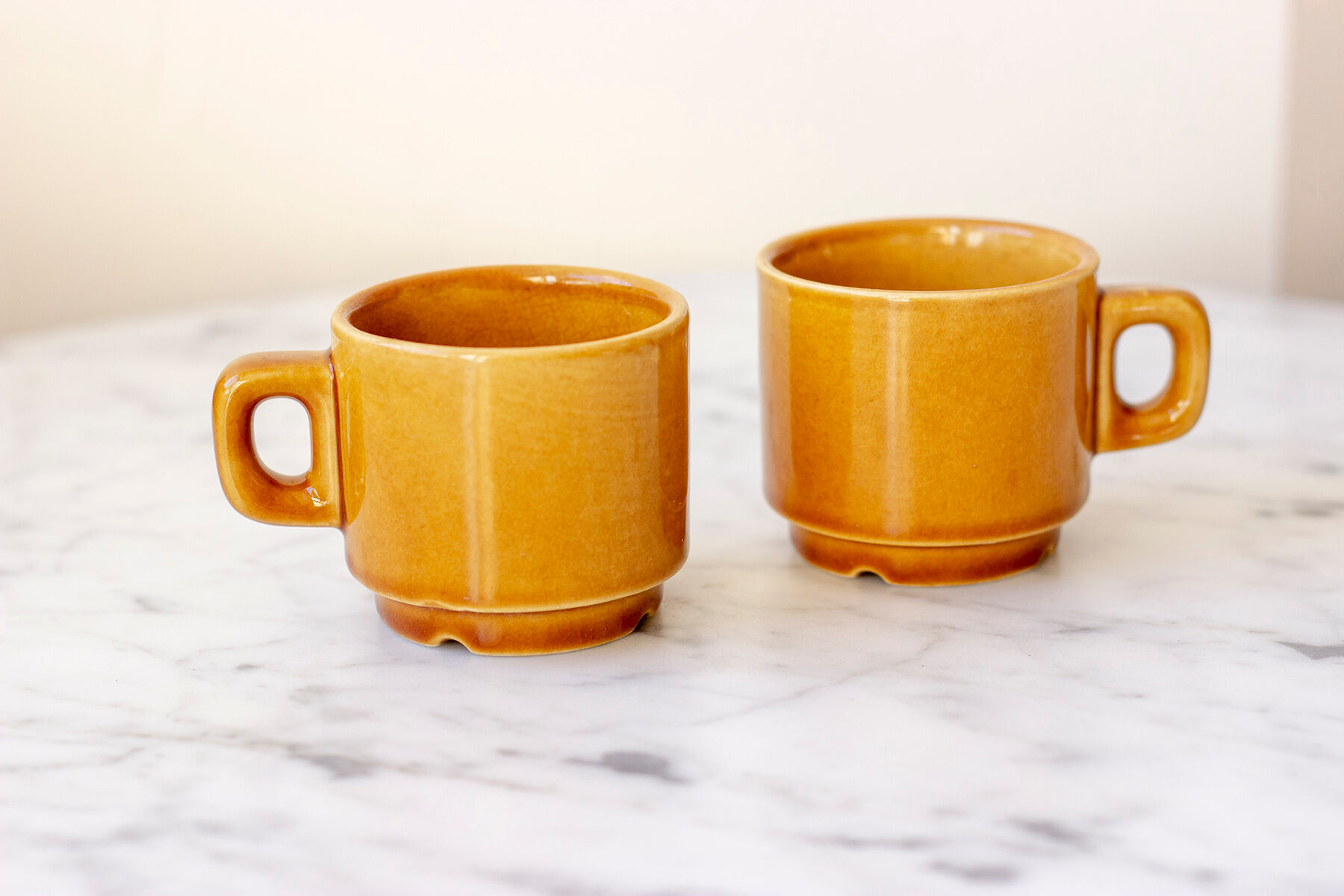 Pair of ochre yellow coffee cups