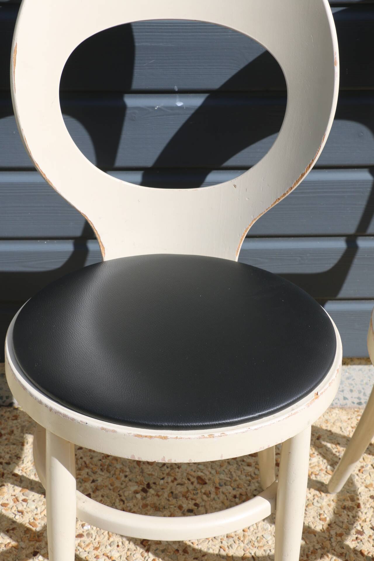 6 baumann chairs, white gull with black faux leather.