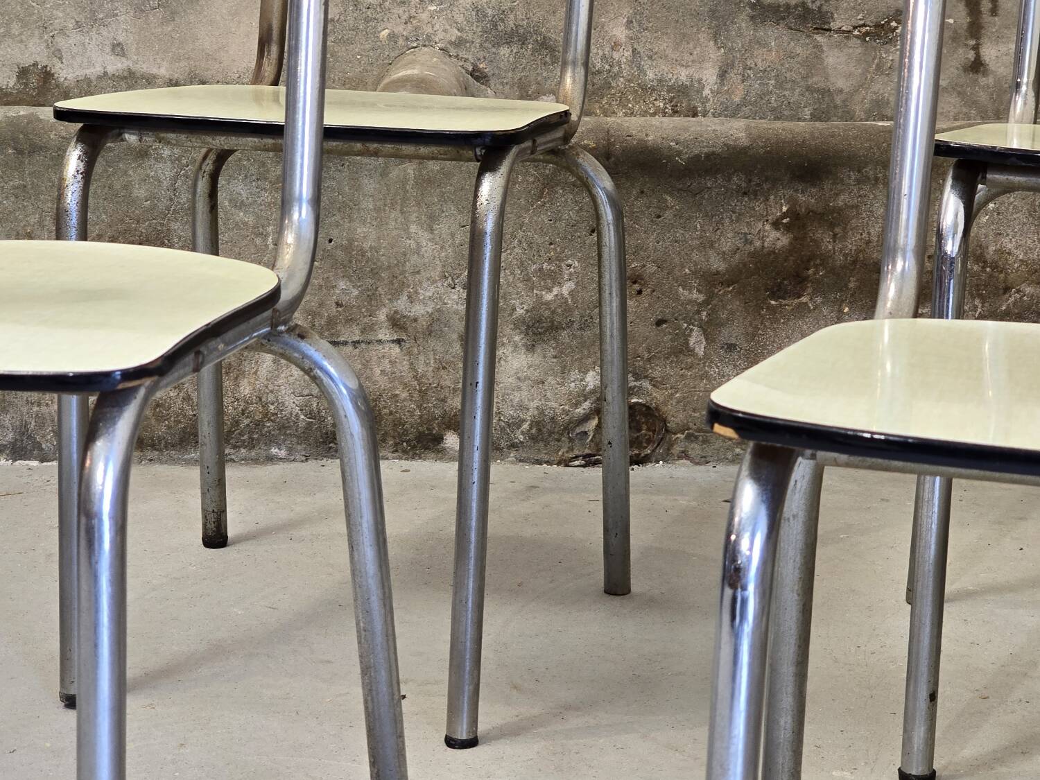 Set of 4 light yellow formica chairs