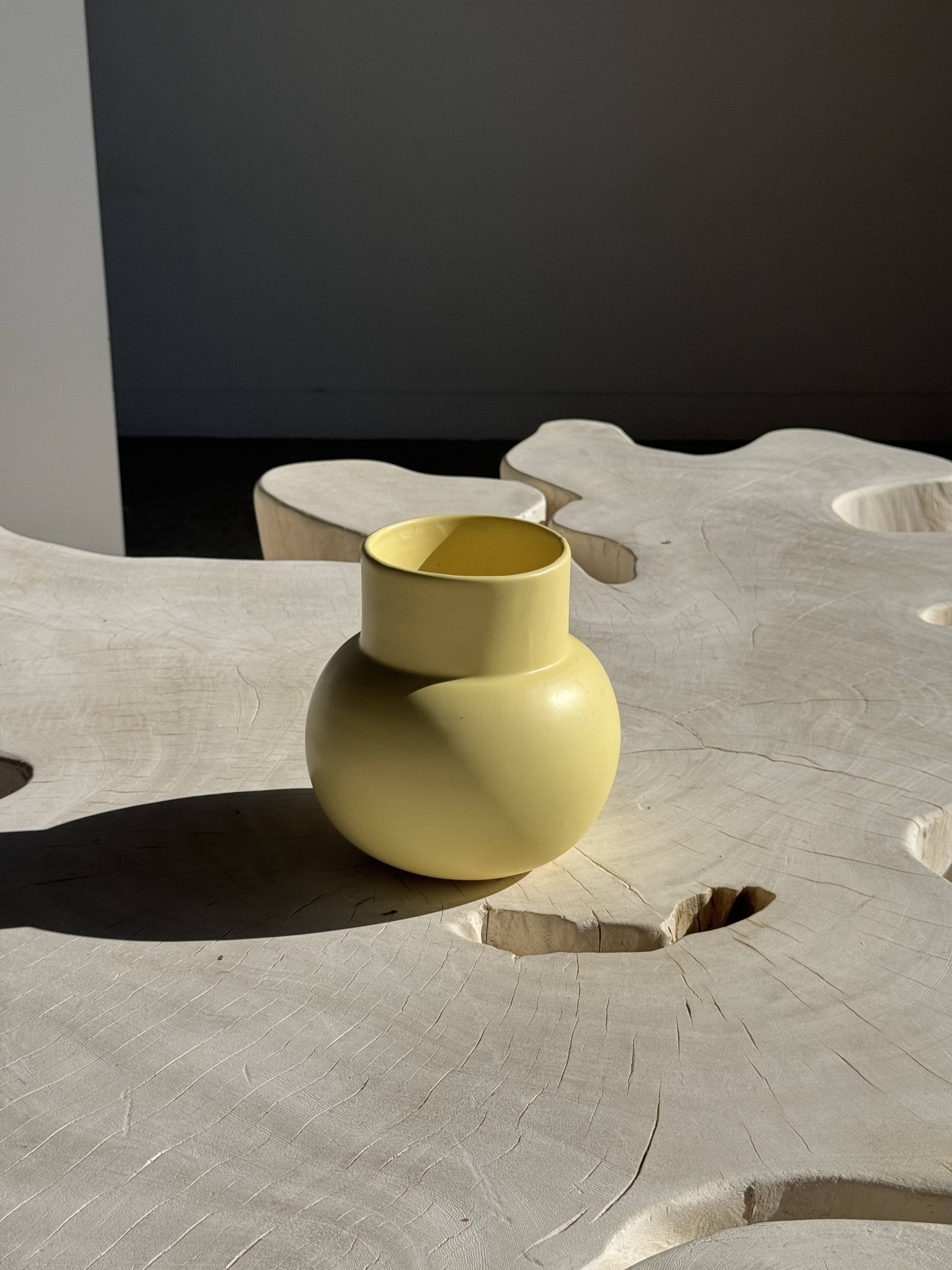 Small light yellow ball vase