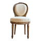 Medallion back chair in moulded wood and beige fabric.