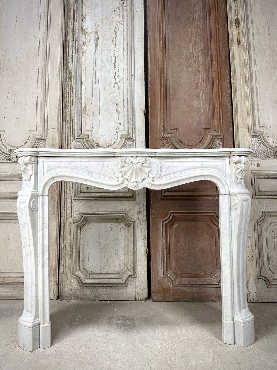 Louis XV style fireplace in white marble