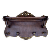 Coat rack and wall-mounted hat rack in an antique style.