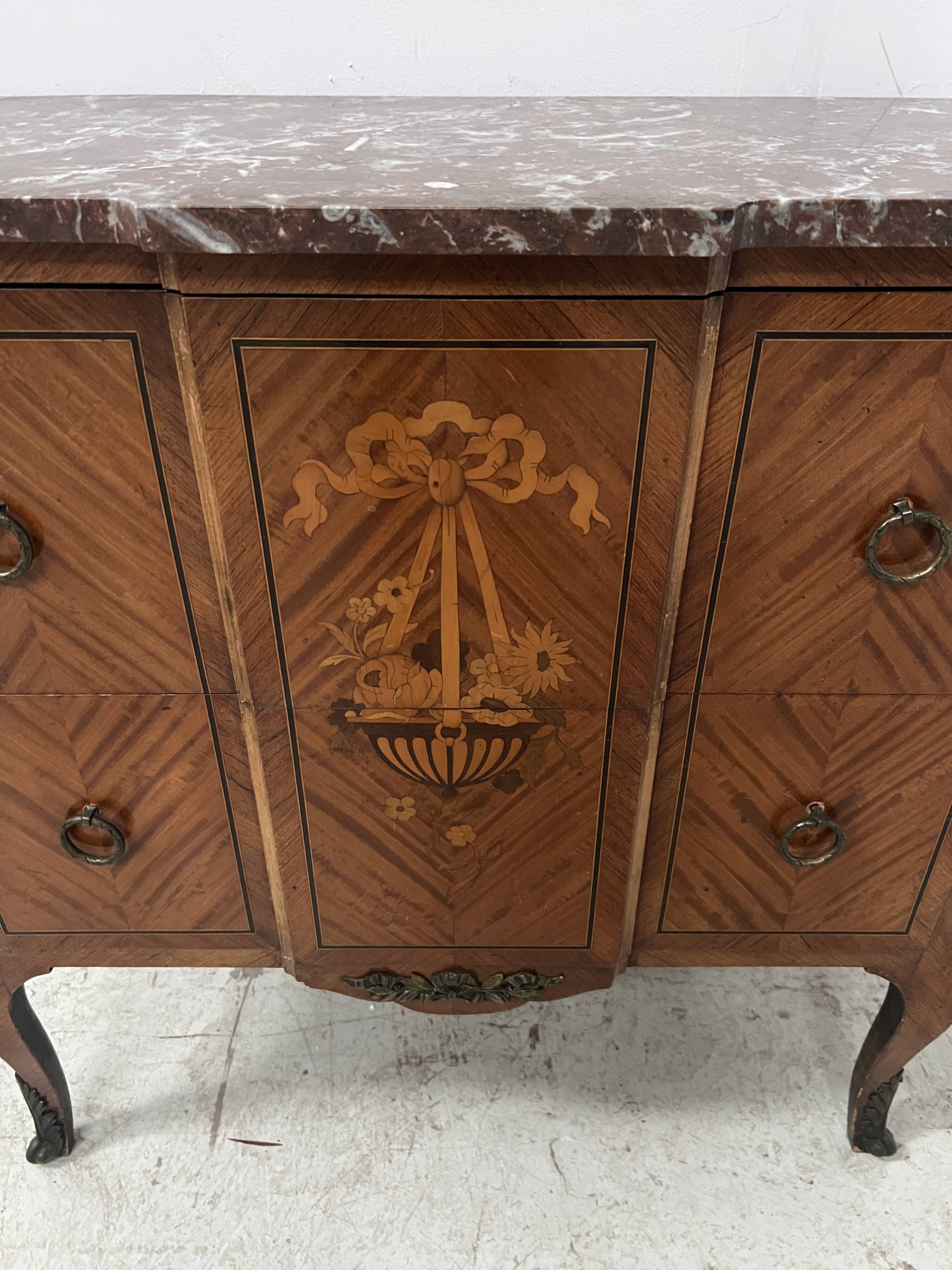 Transitional style commode with a protruding front, in marquetry wood, 20th century.