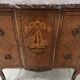Transitional style commode with a protruding front, in marquetry wood, 20th century.