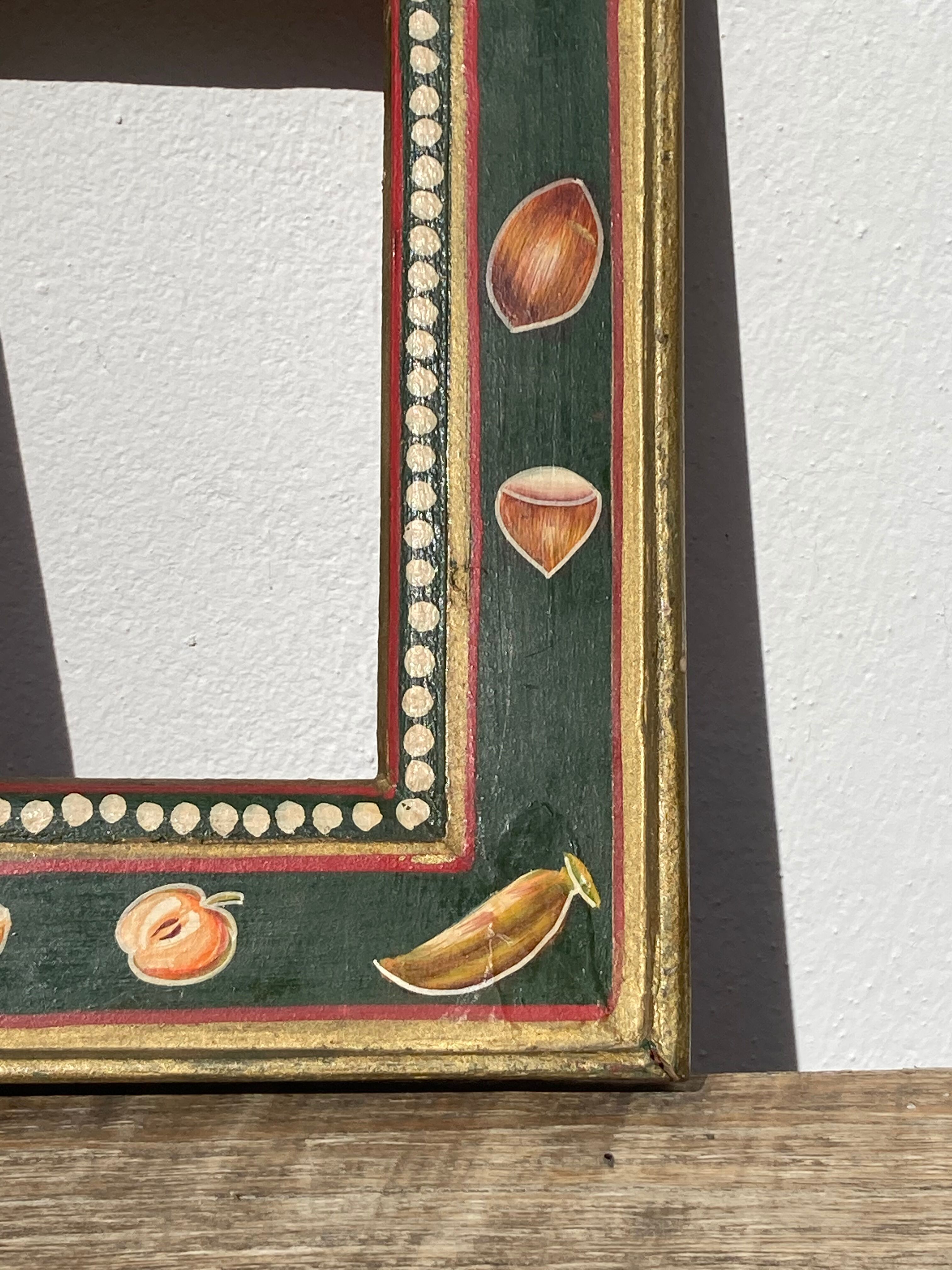 Hand-painted wooden frame with fruit decoration
