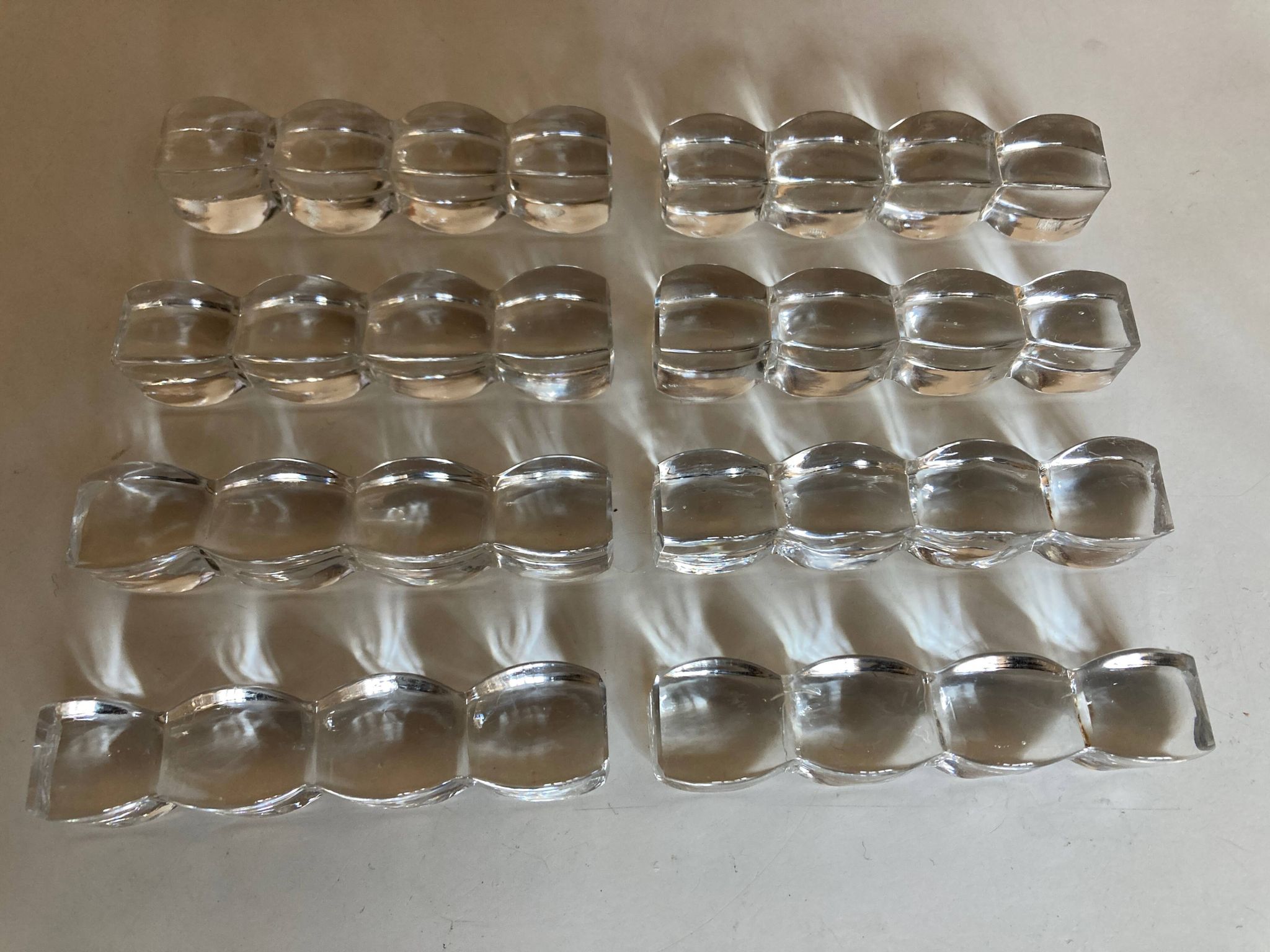 Set of 8 modernist crystal knife rests from the 1940s.
