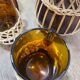 Carafe and glasses in amber glass and rattan