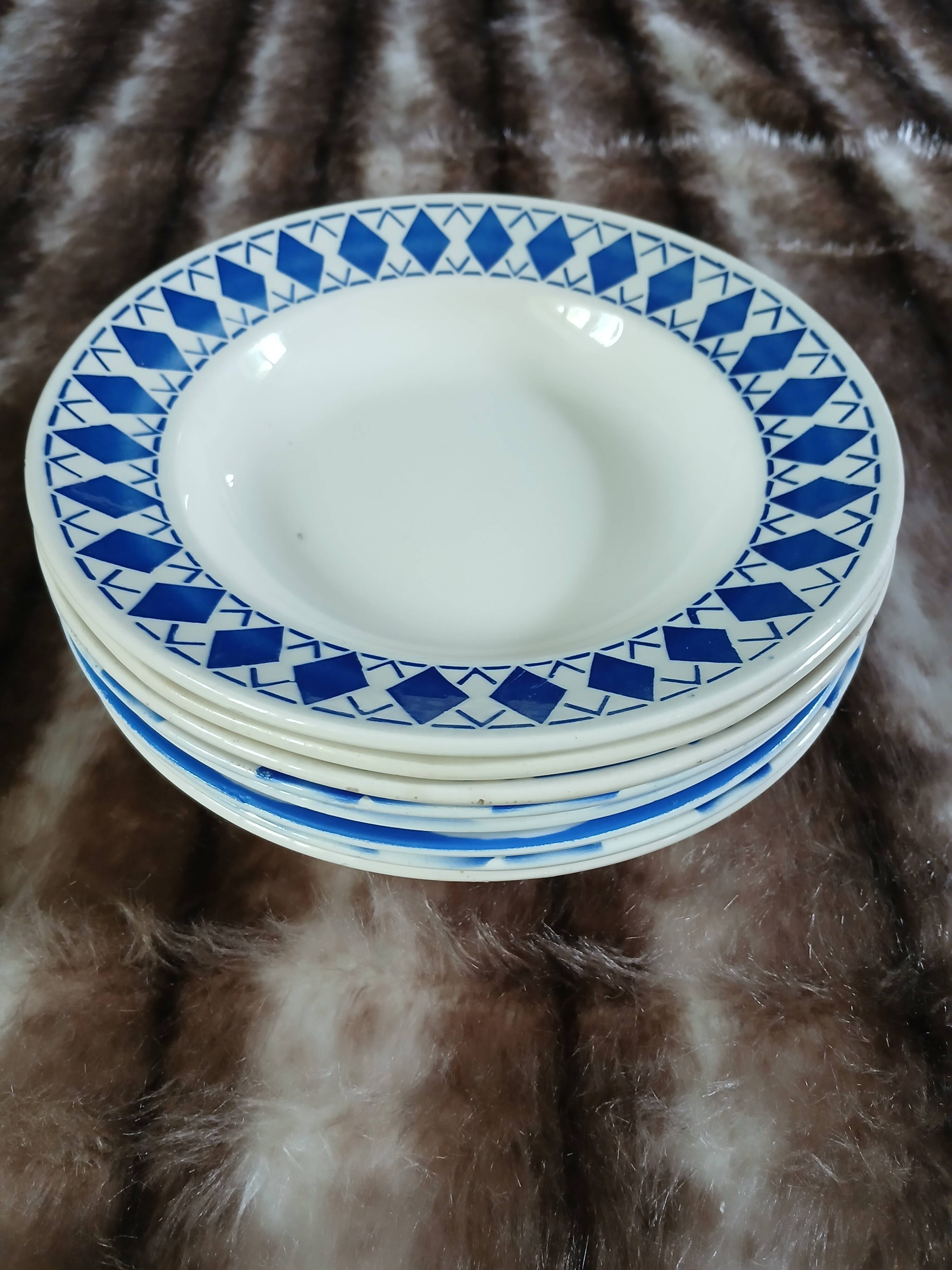 8 mismatched antique deep plates
