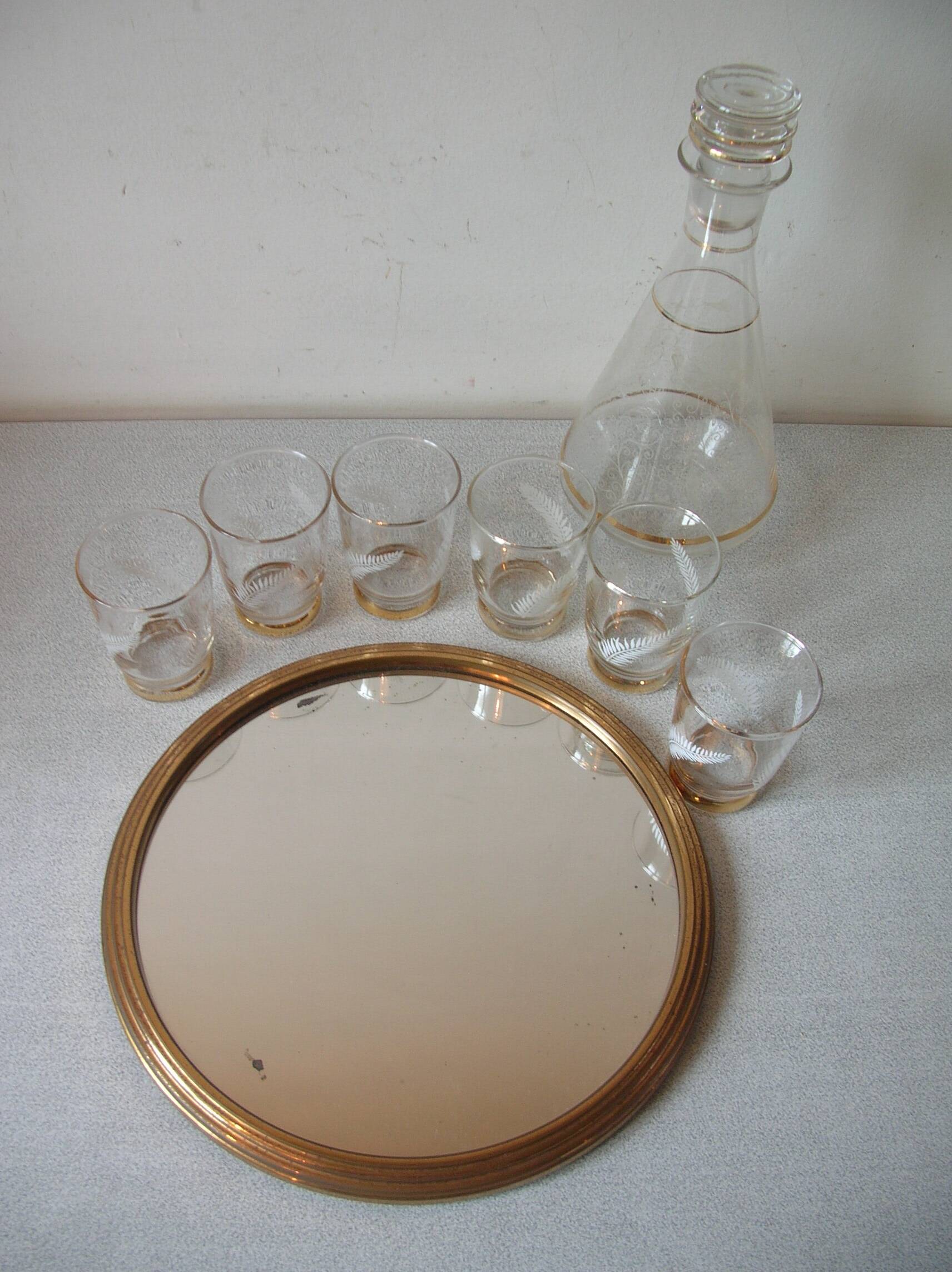 Old glass carafe liquor service with gilding vintage ice mirror tray