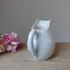Old small jug, handmade ceramic milk pot with hand-painted floral decoration in the Vallauris style.