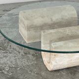 Coffee table in travertine and glass