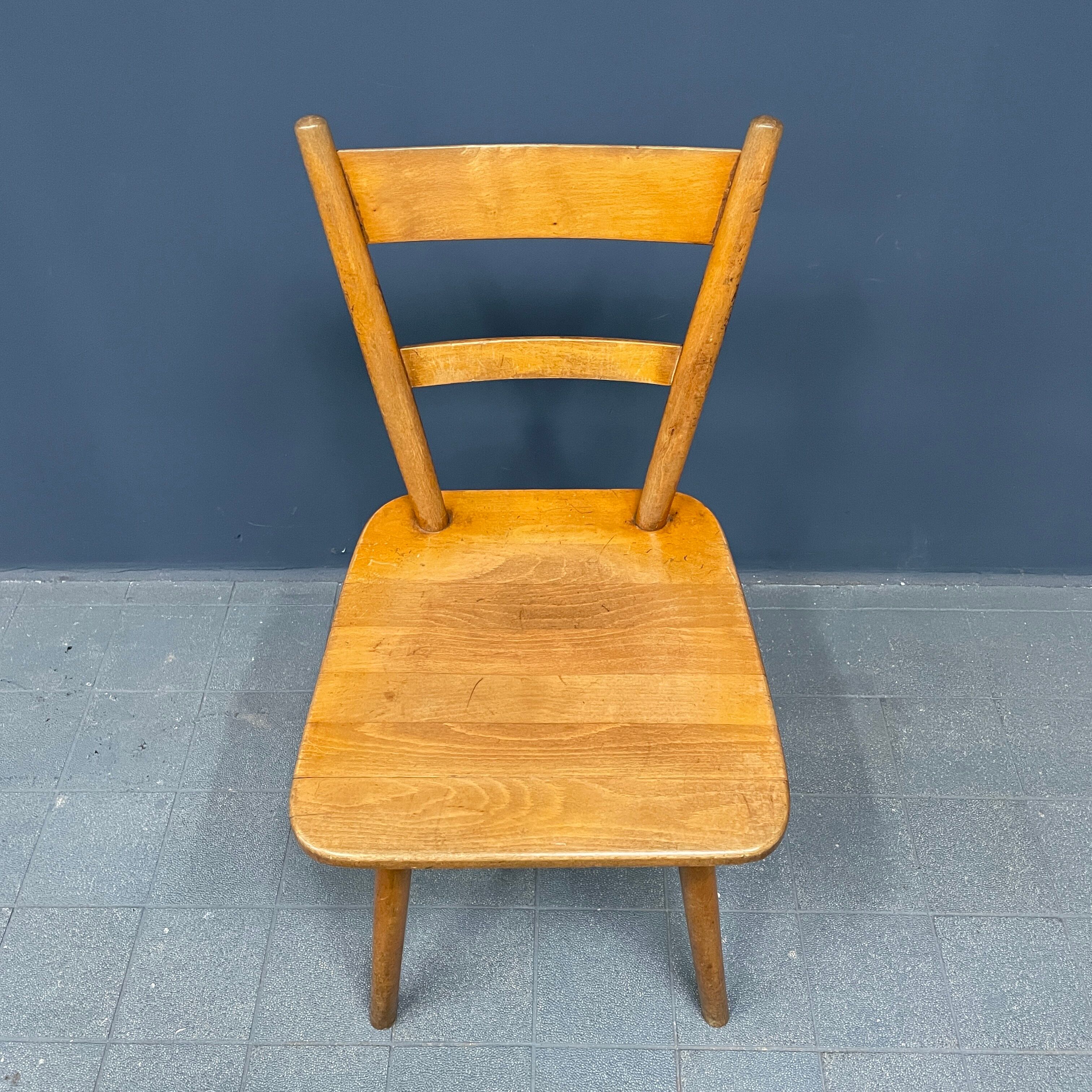 Set of eight german stick chairs from the 1950