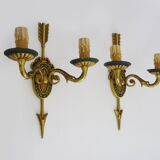Pair of double-light Empire style arrow wall lights in bronze. Early 20th century