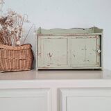 Small old wall shelf with sliding doors