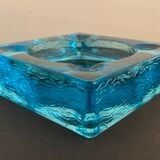 Ashtray paved in blue glass
