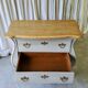 Curved patinated chest of drawers