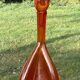 Bouteille en verre bullé orange  à panse incurvée, vers 1970