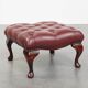 In very good condition elegant red/brown chesterfield ottoman made of cow leather