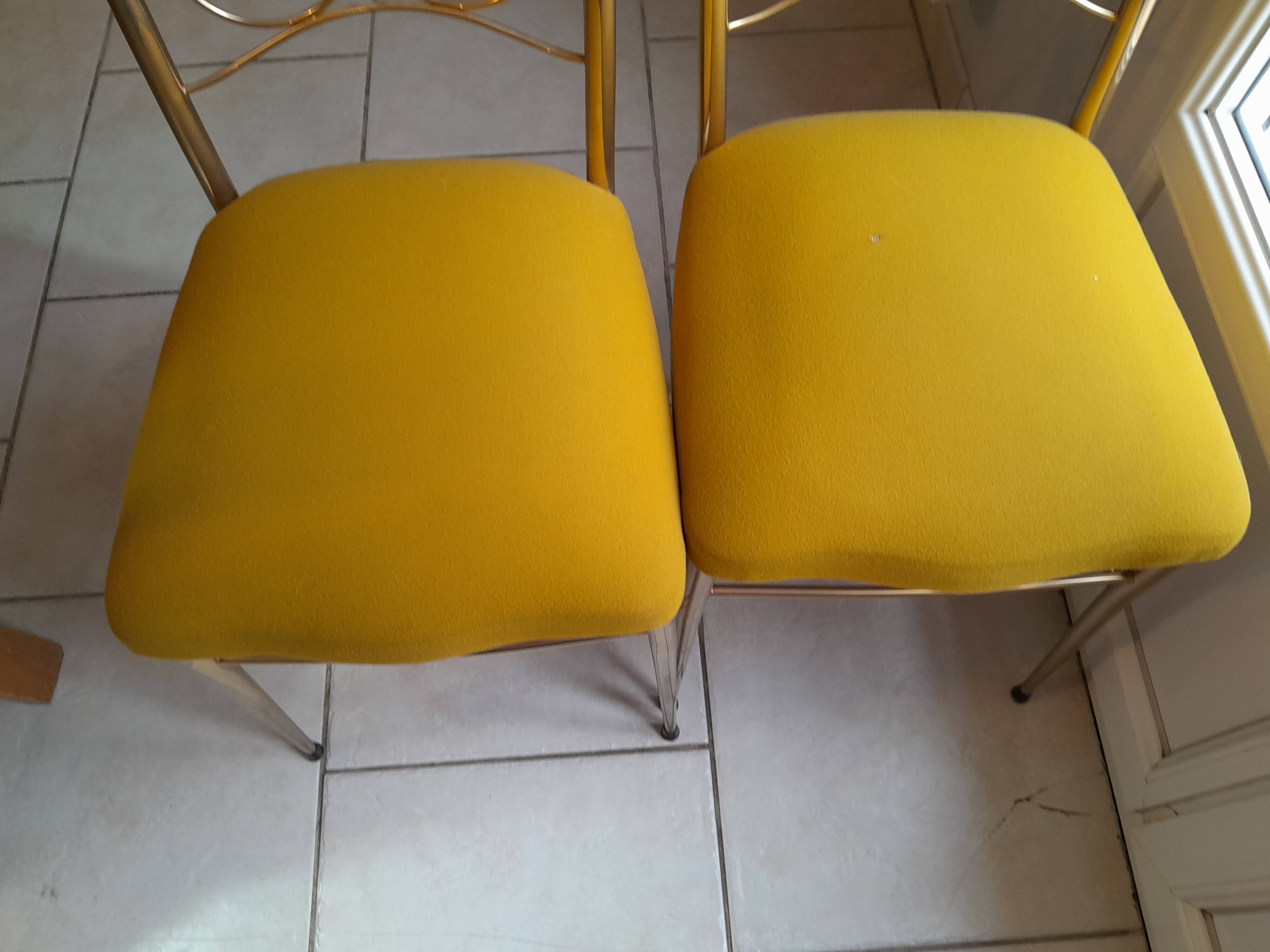 Pair of vintage golden designer chairs from the 50s