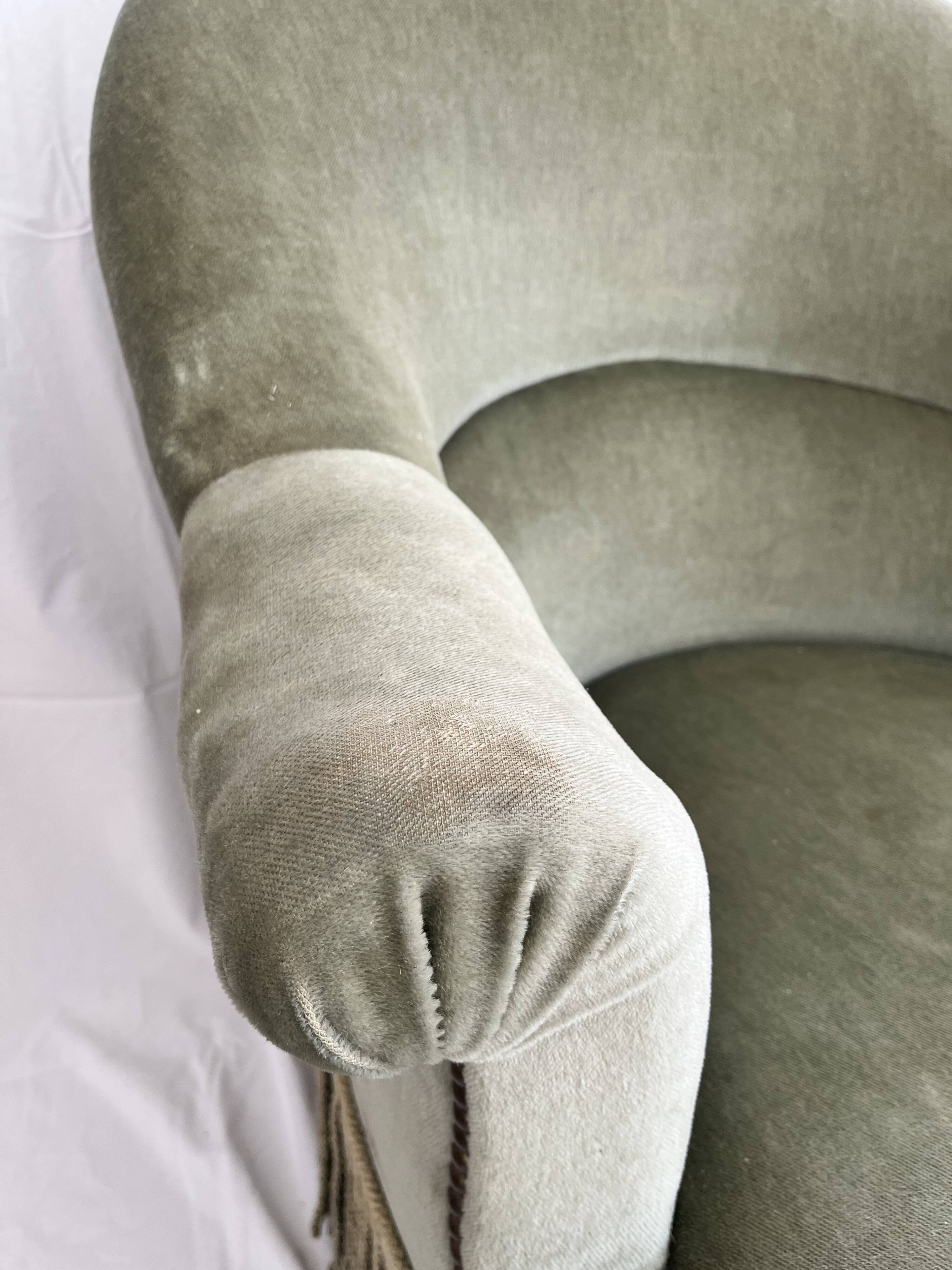 sage green toad armchairs with gold fringe