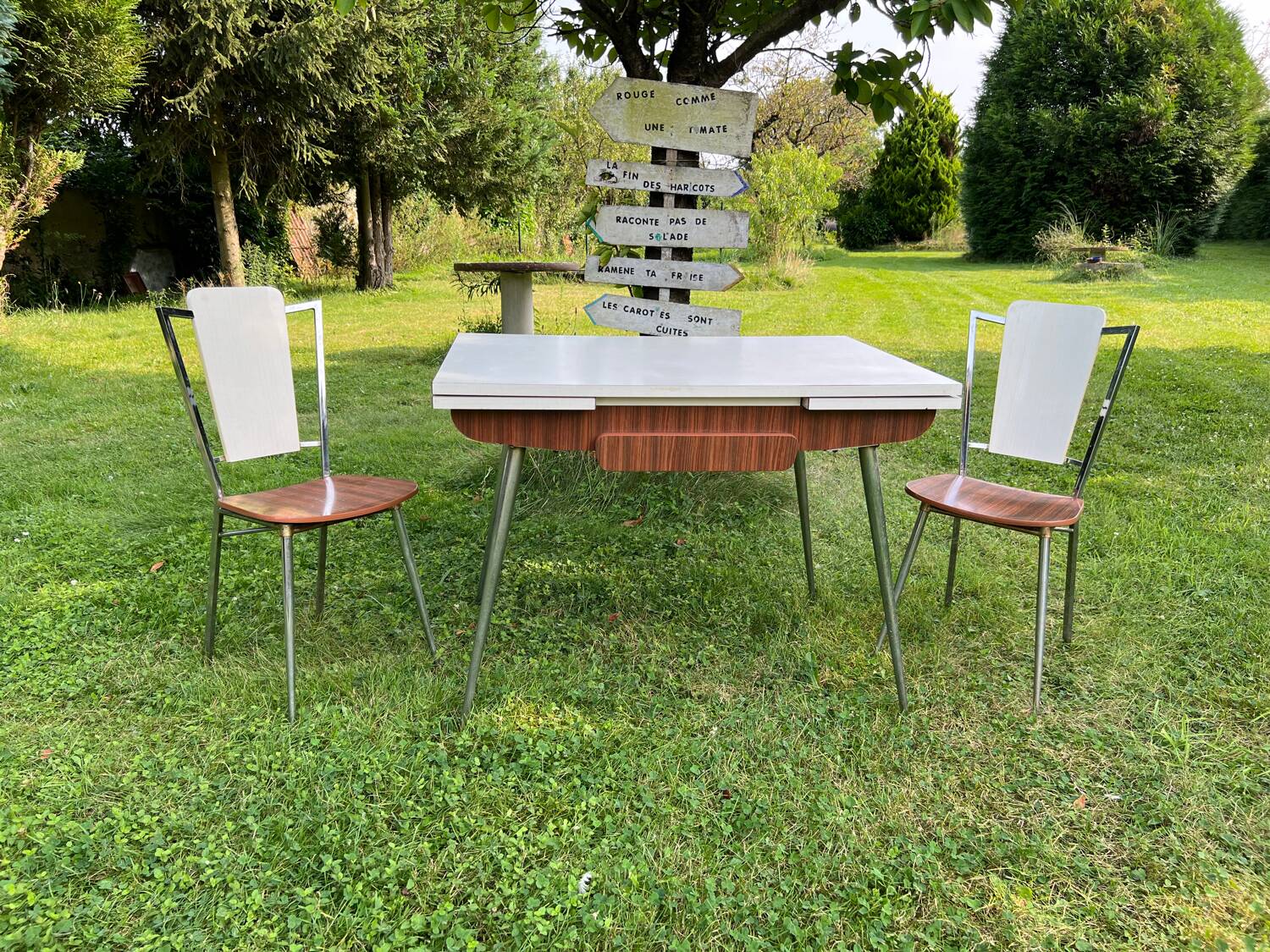 White Formica table with extensions and 2 designer chairs
