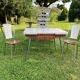 White Formica table with extensions and 2 designer chairs