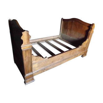 Old wooden bed on wheels