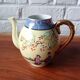 Vintage Japanese fine porcelain tea set with landscape pattern.