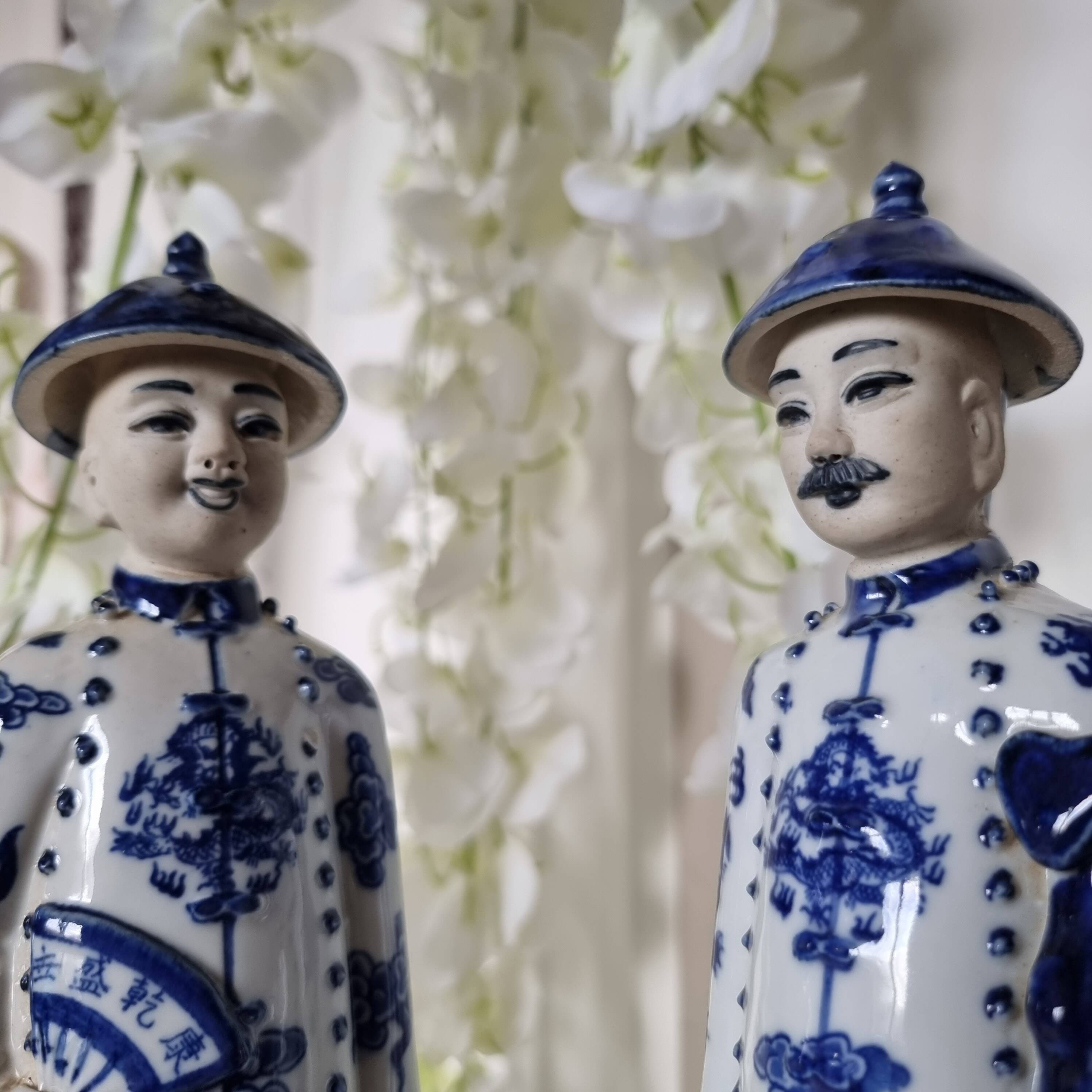 Pair of vintage Chinese blue and white porcelain figurines depicting