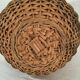 Wicker basket with a wooden bead border