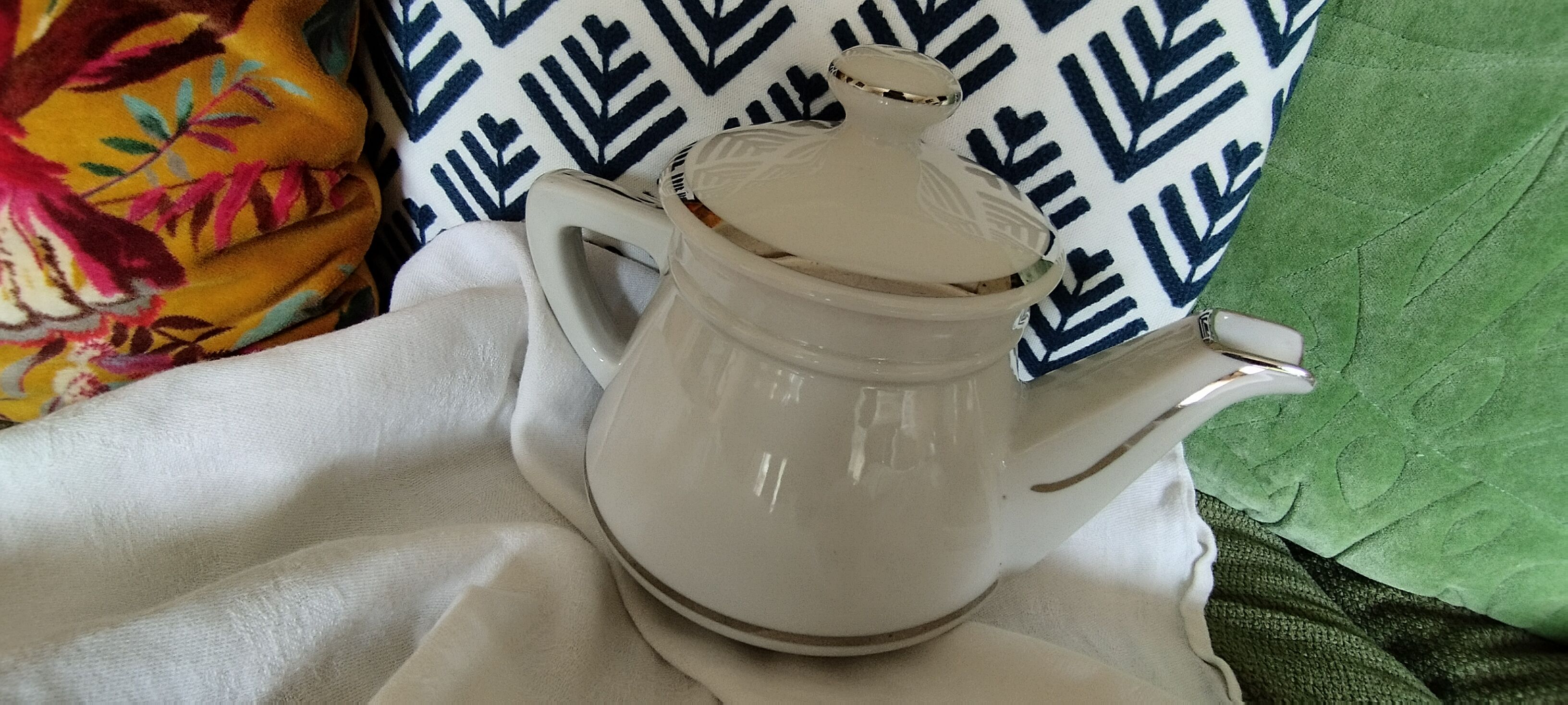 White and silver porcelain teapot
