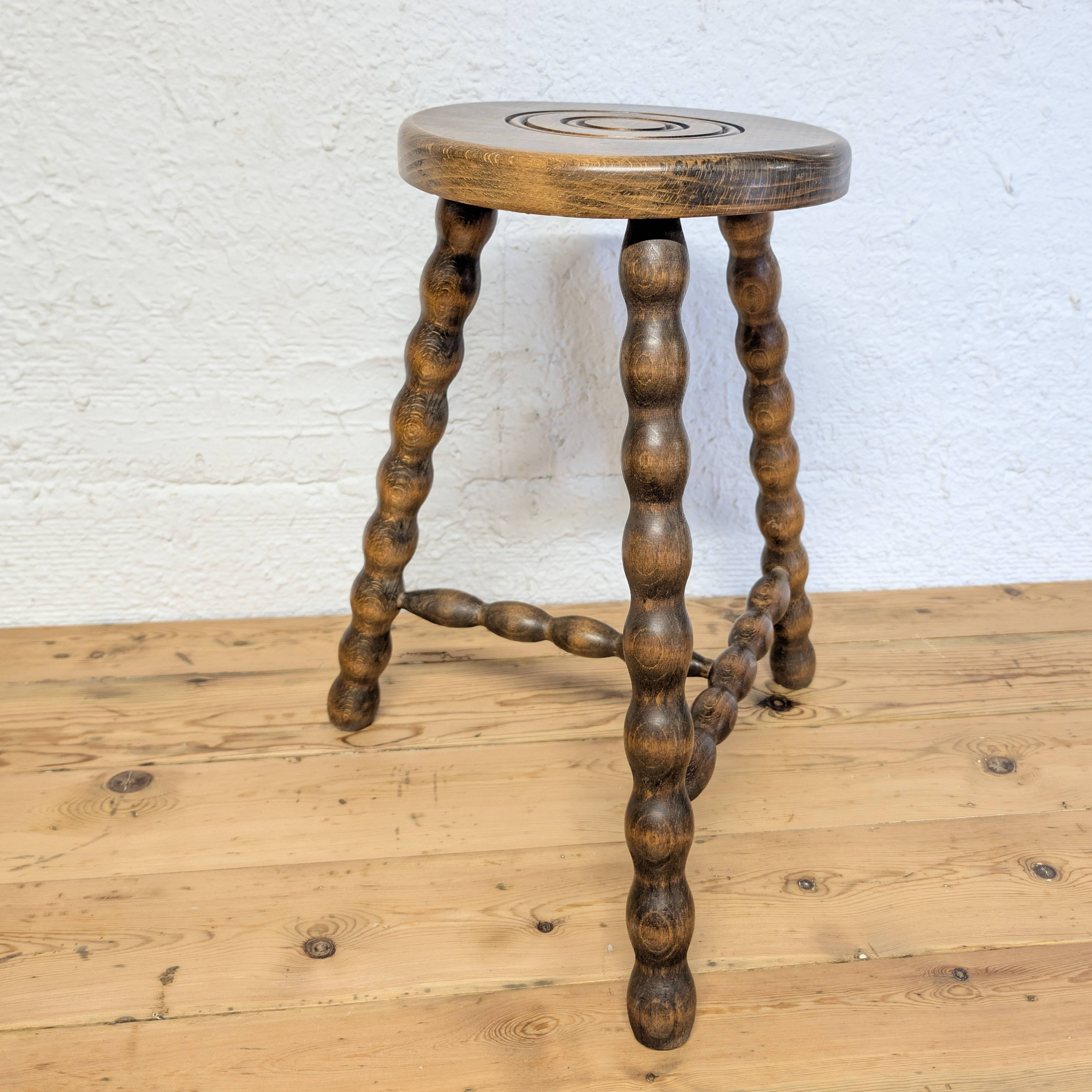 Turned wooden tripod stool