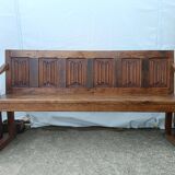 Oak church bench period XVII th century, back decorated with carved parchments